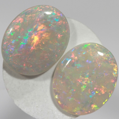 SOLID SEMI BLACK OPALS Matching pair, bright multicolours
